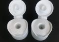Flow-control flip-top squeeze tubes